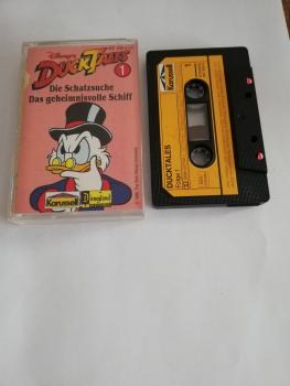 Duck Tales Folge 1 Die Schatzsuche/ Das geheimnisvolle Schiff Schwarz mit Gelben Aufkleber 837 503-4 Karussell(Seite 1 der MC minimal beschrieben)